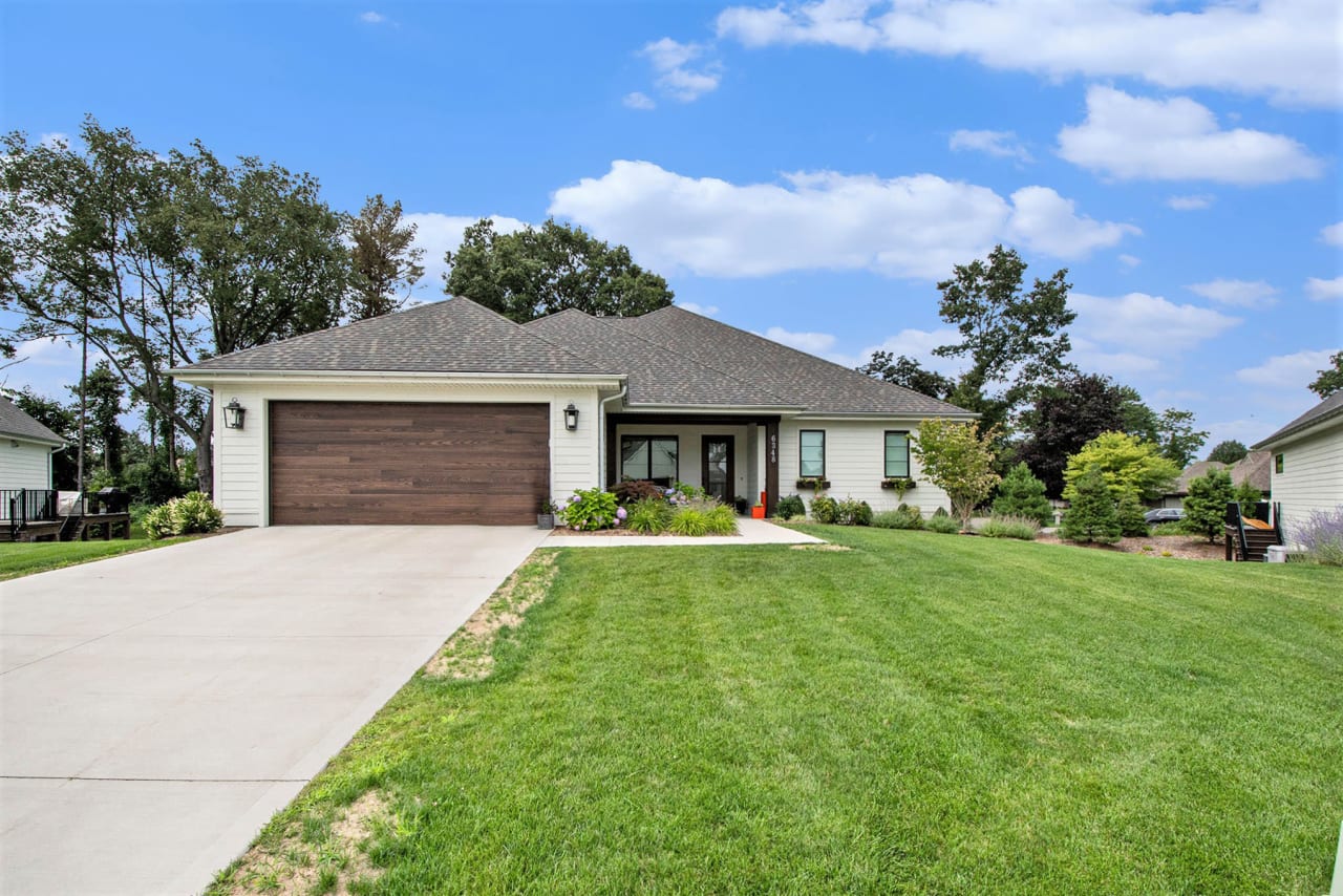 exterior front view of a single family home with driveway