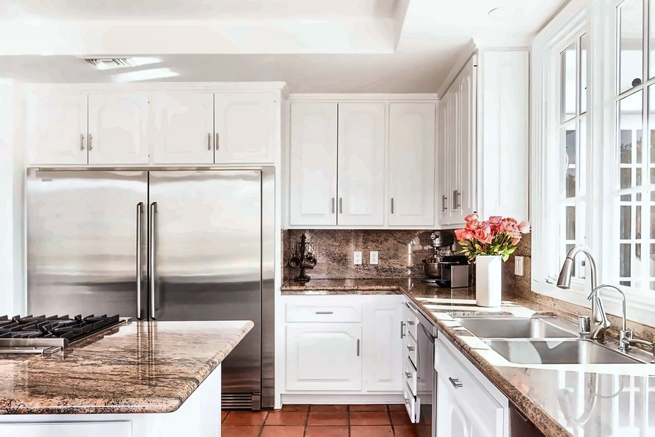 Chef's kitchen opening to the garden in a Brentwood luxury rental