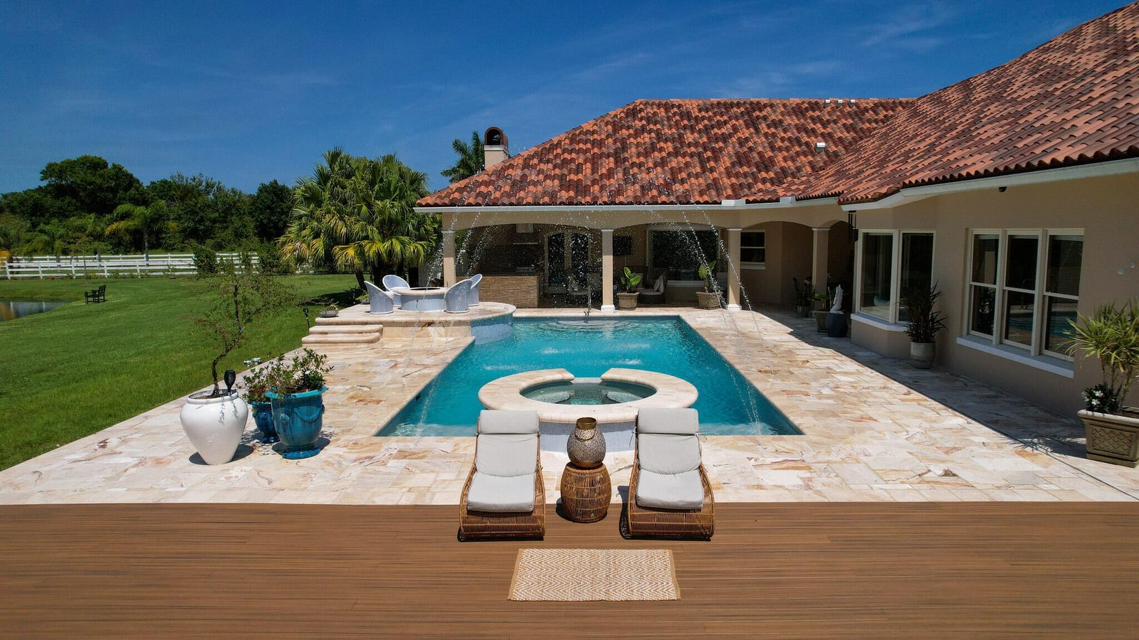 Pool deck and spa at a private Vero Beach acreage estate