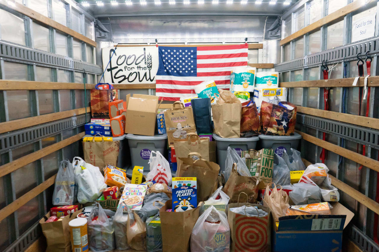 A truck filled with boxes and bags of food