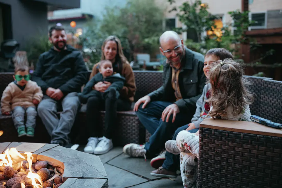 People gather outdoors at Radish, a co-living community in Oakland, Calif.