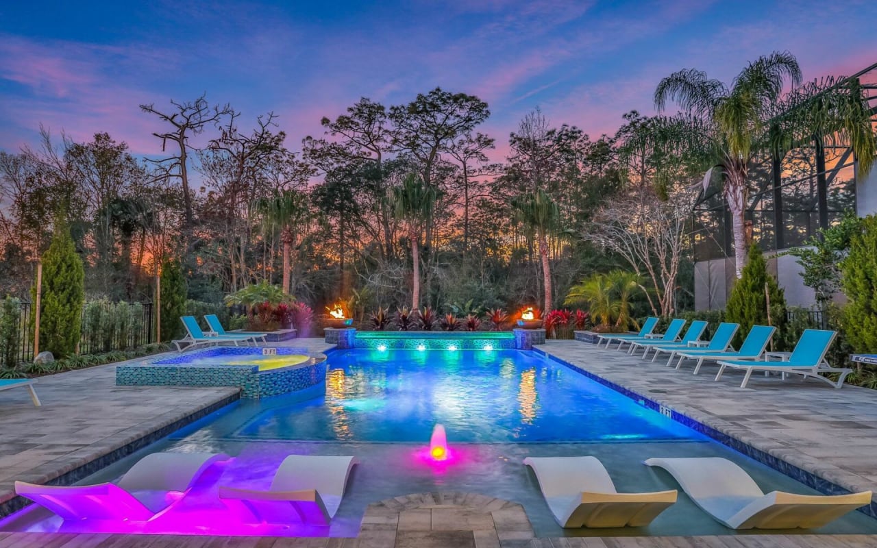 A large, rectangular swimming pool with a built-in jacuzzi.