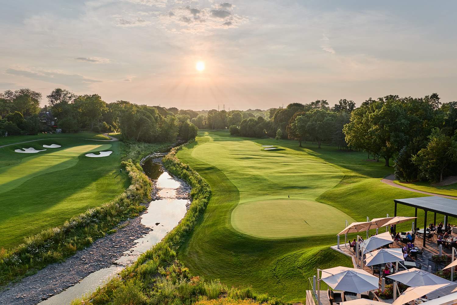 The patio at Islington Golf Club at sunset, overlooking the 10th and 18th holes