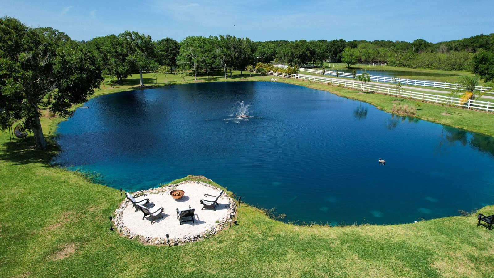 Aerial view of the private stocked fishing lake on a Vero Beach acreage estate