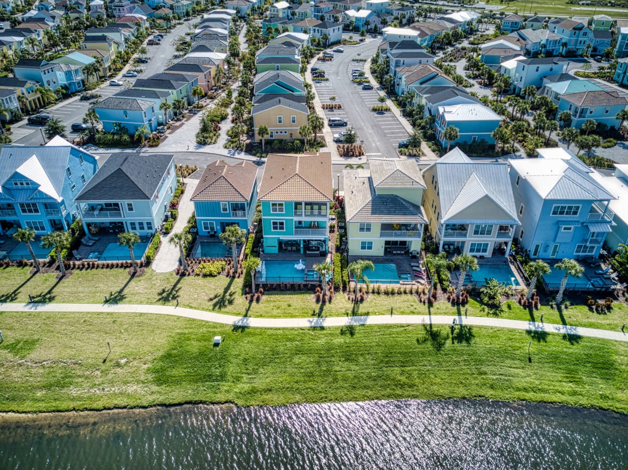 An aerial view of a residential homes with driveways and walkways lead to the houses.