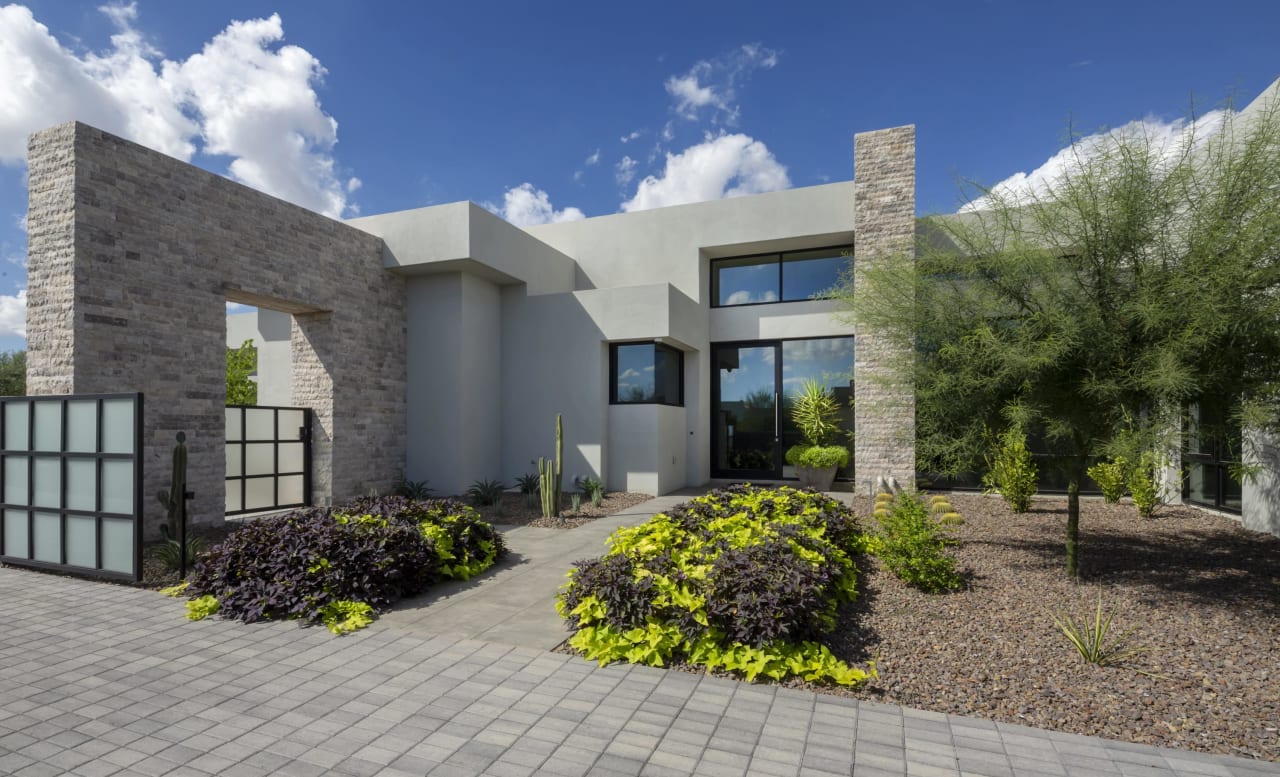 Entry to modern home made of stone and concrete