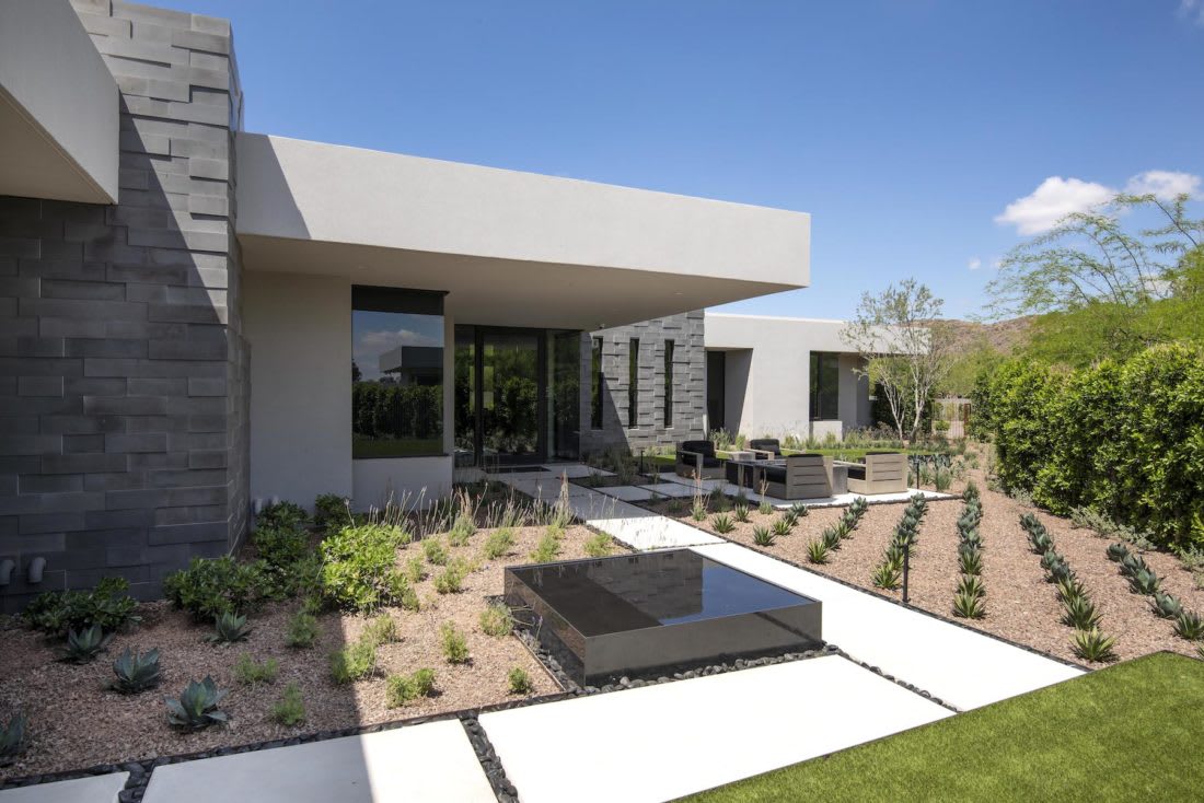 Entry to modern home made of concrete and steel