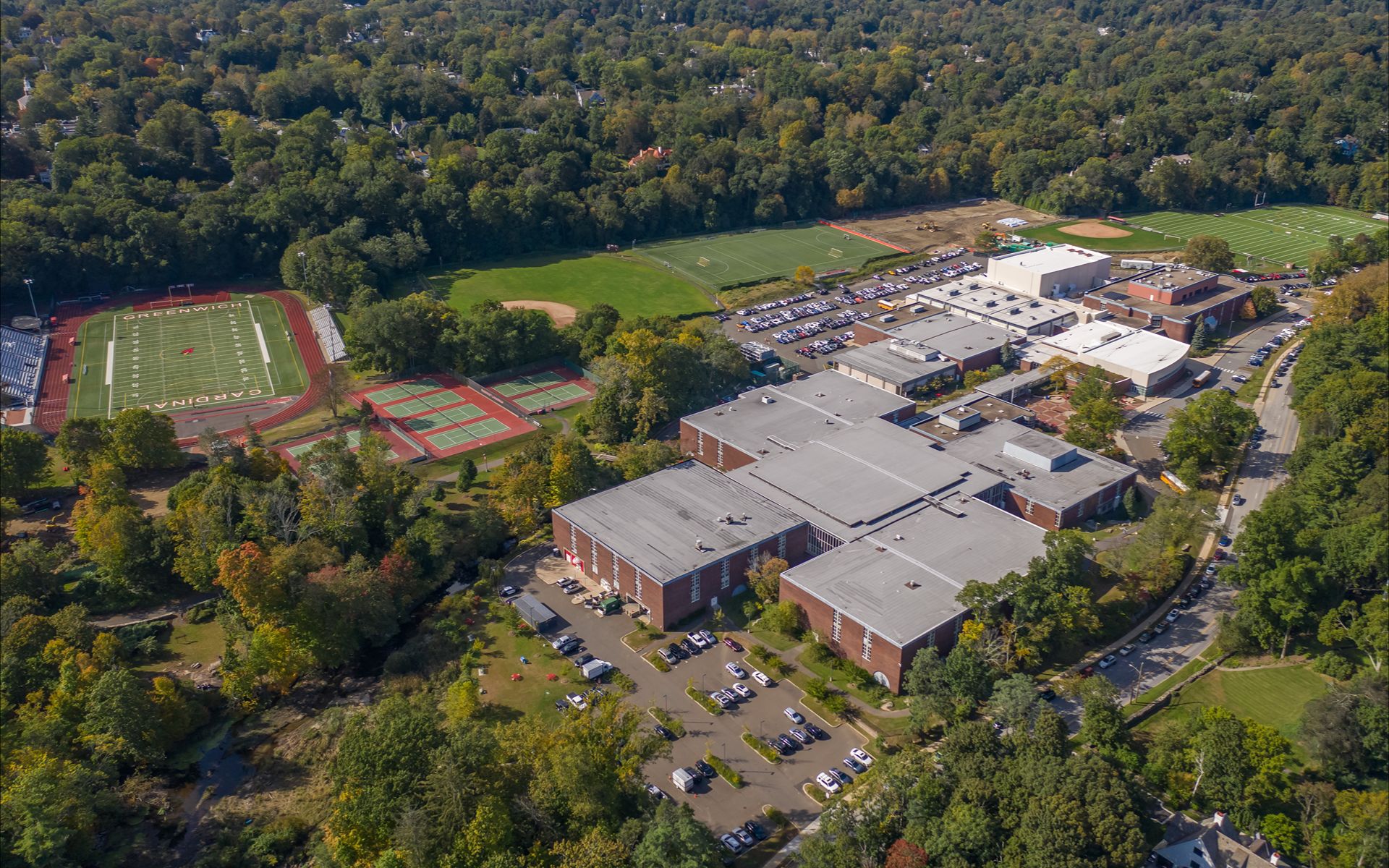 A leafy independent-school campus, or students crossing a quad