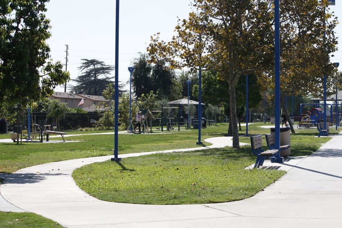 Trees and walking paths at Clara Street Expansion Park beside Elizabeth Learning Center in Cudahy