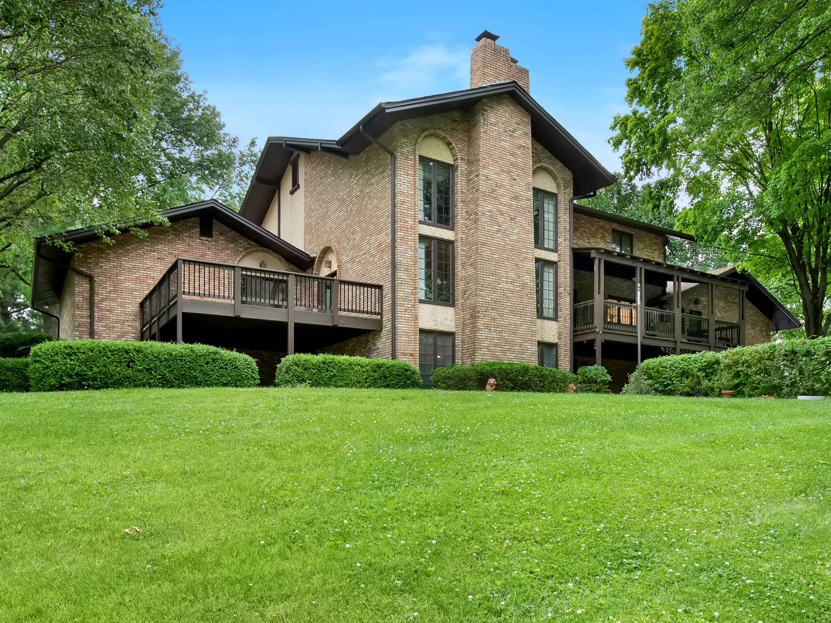 Stone home on a wide lawn sold by Alyssa Suntrup