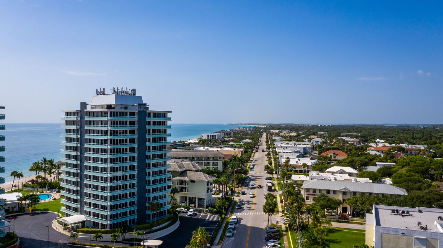 Aerial view of an oceanfront condominium tower on Ocean Drive, Vero Beach, Florida, looking north along the barrier island