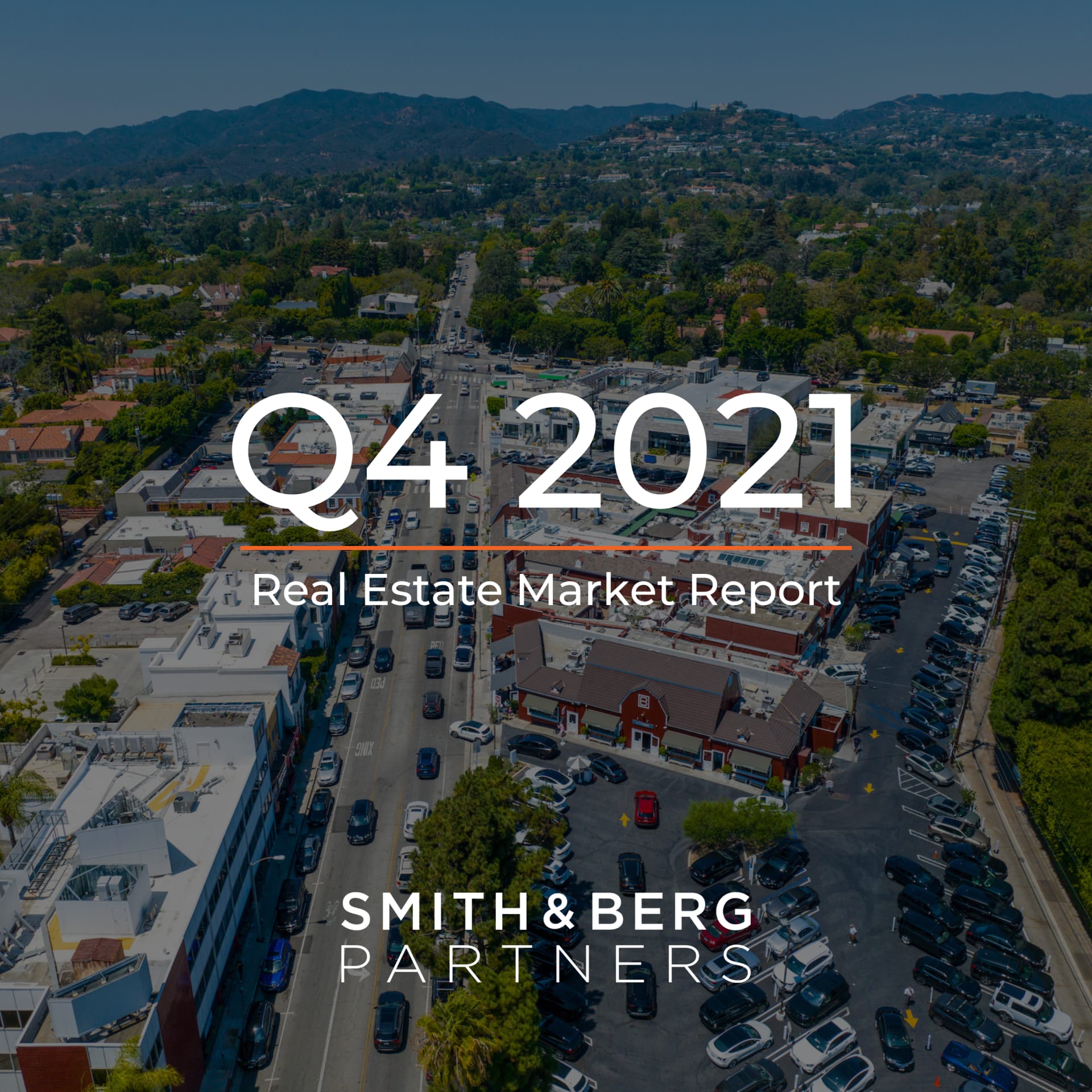 The cover of a "Real Estate Market Report" for "Q4 2021" features an aerial view of a bustling urban street with cars and buildings, surrounded by residential areas and lush green hills in the distance.