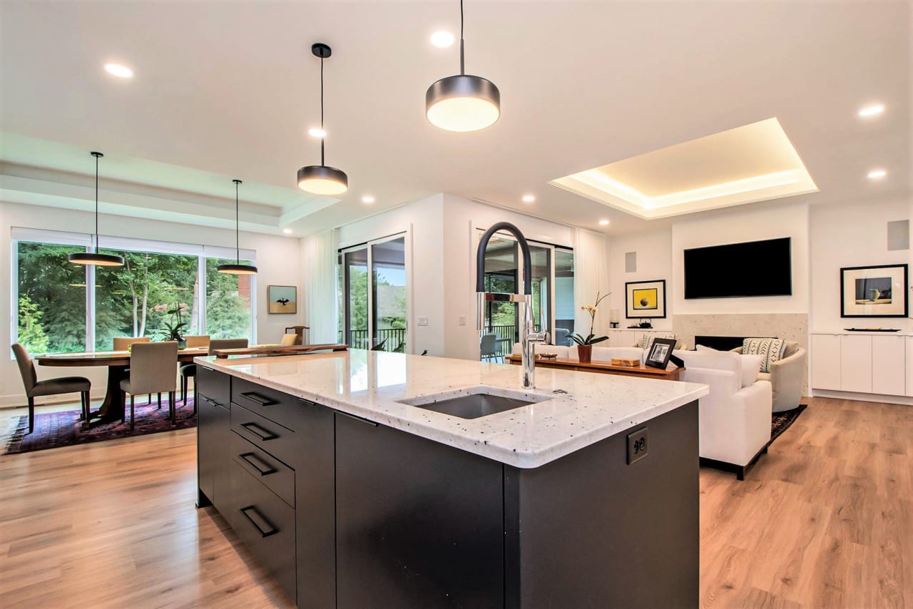 kitchen countertop with dining and living area in the background