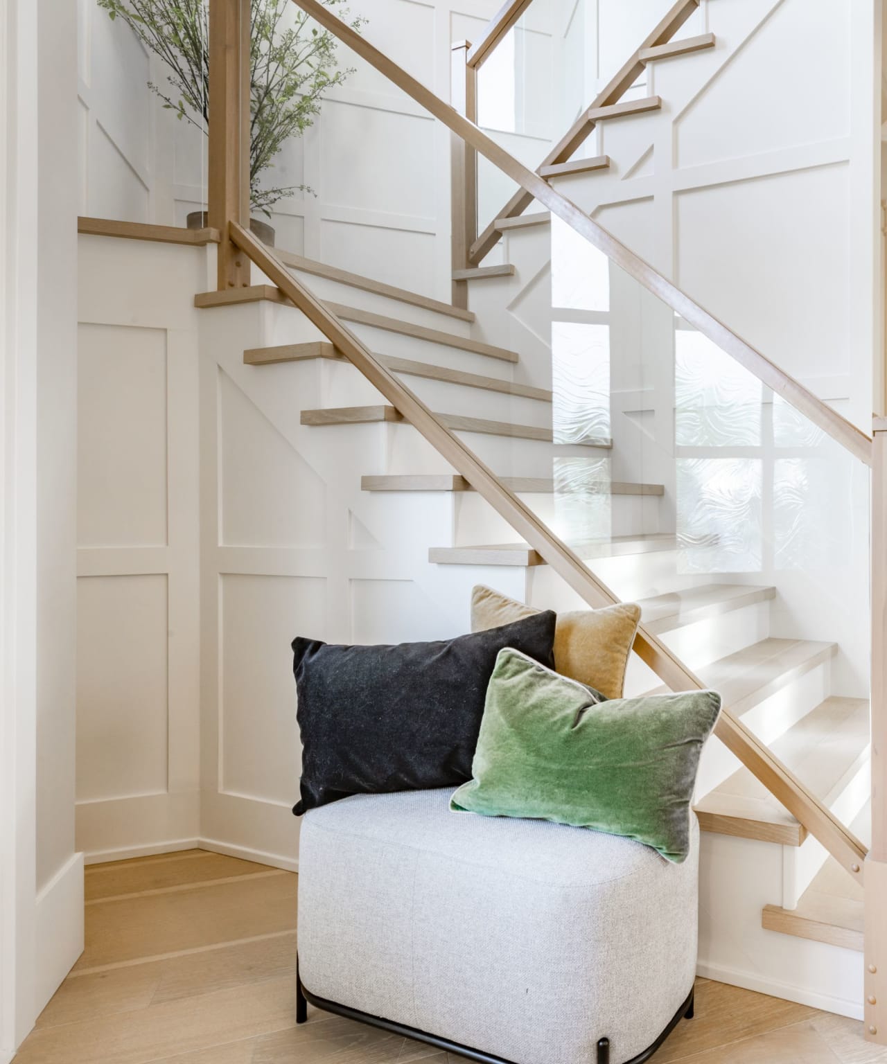 round sofa chair near a staircase in a home for sale in Midland, GA