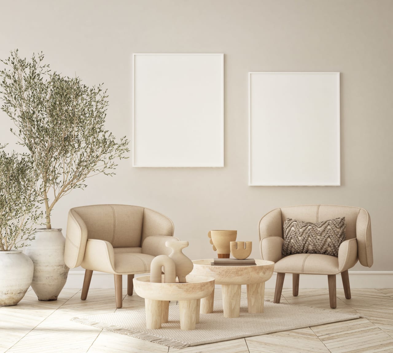 A living room with two mid-century modern armchairs, a round coffee table, and two empty picture frames on the wall.