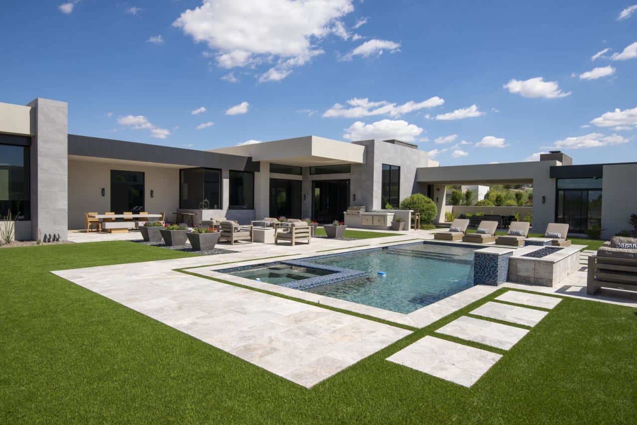 Private backyard of luxury modern home with custom pool