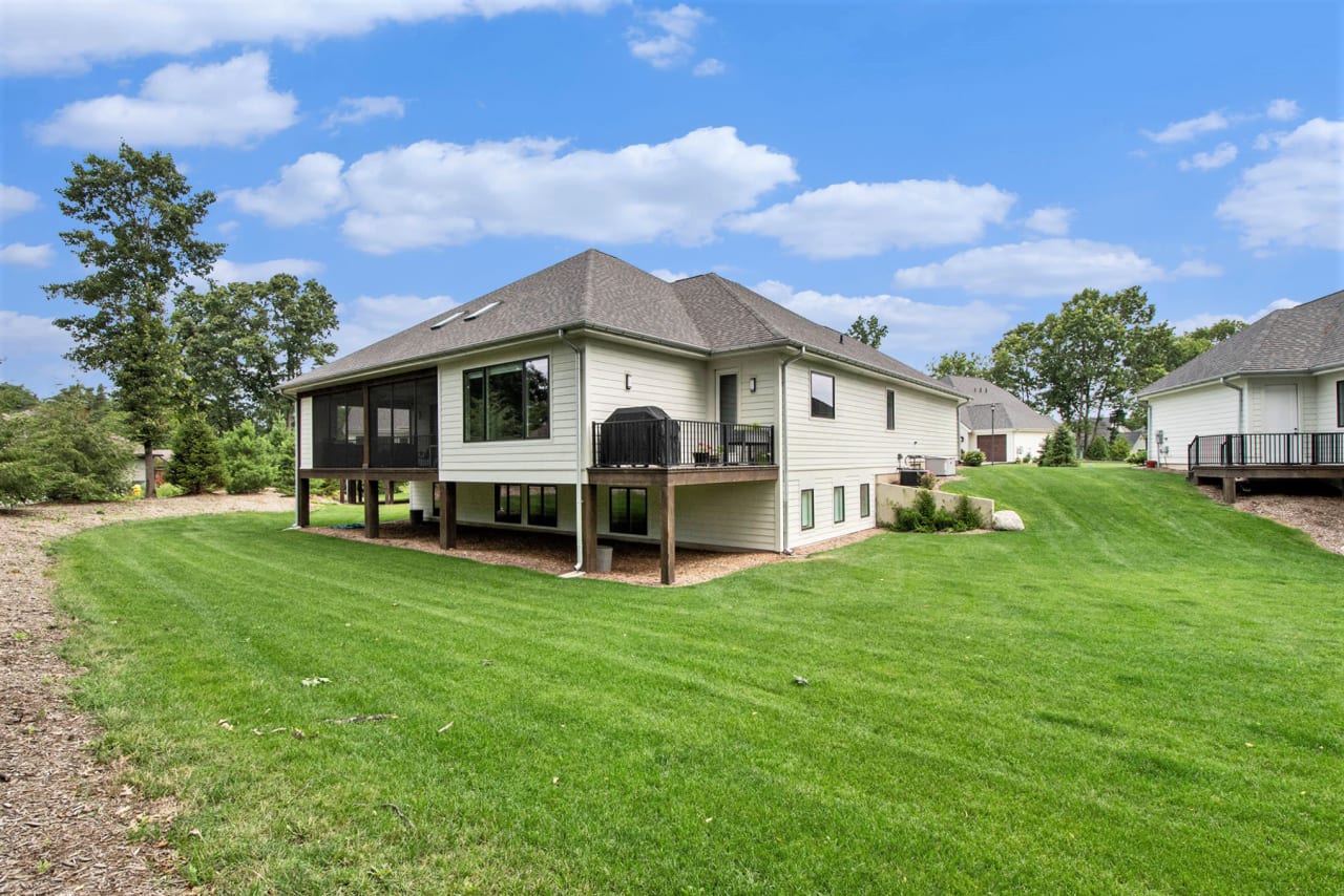 exterior of a modern house surrounded by green lawn