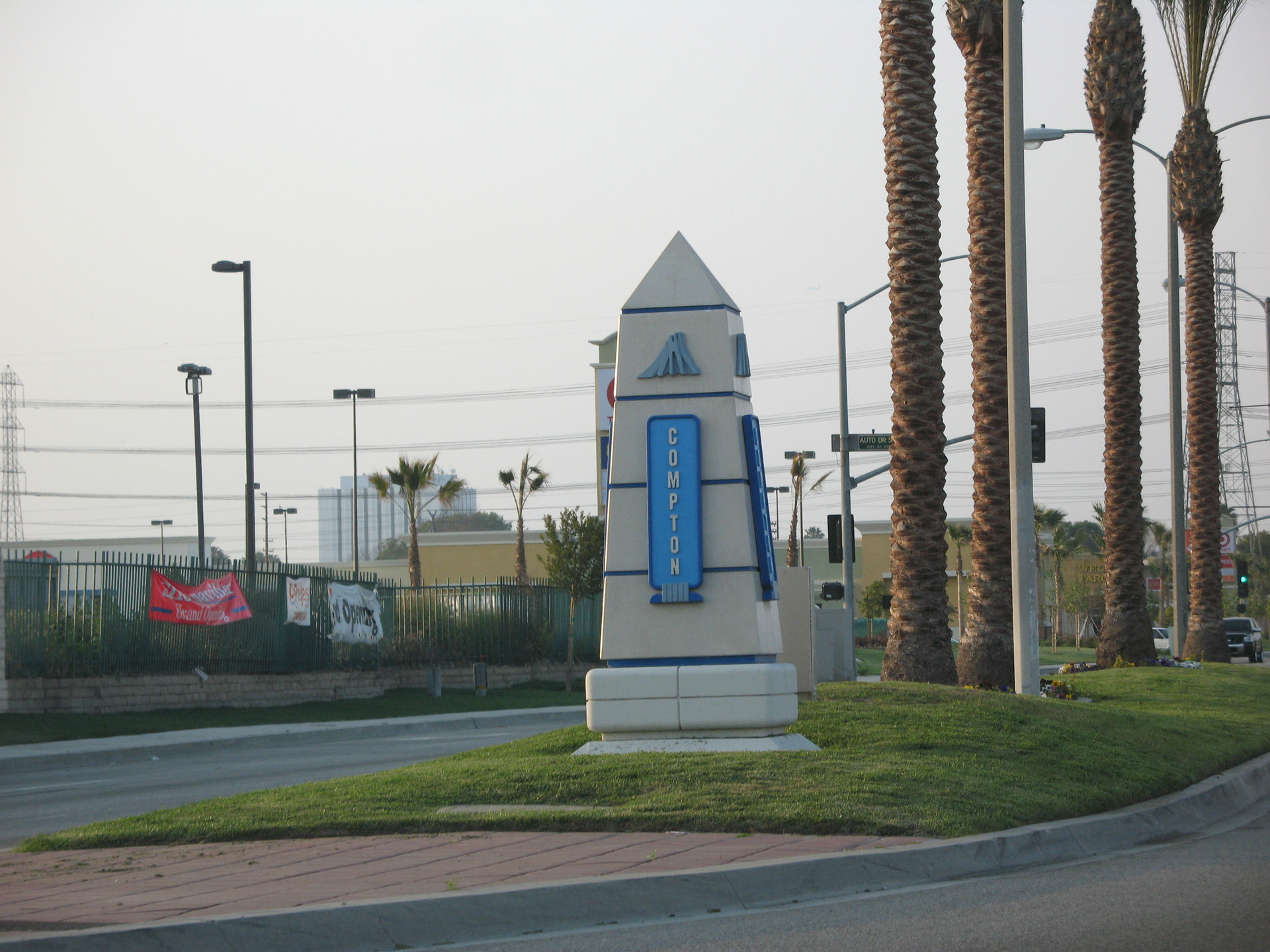 Compton city gateway monument on a palm-lined median, photographed in 2008