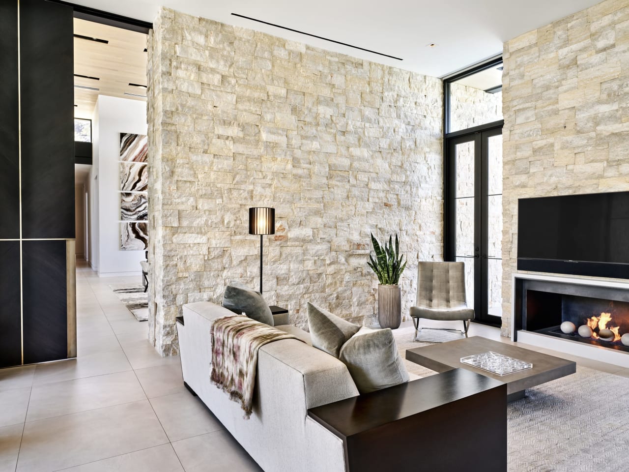 Luxury modern estate with indoor outdoor living and limestone walls