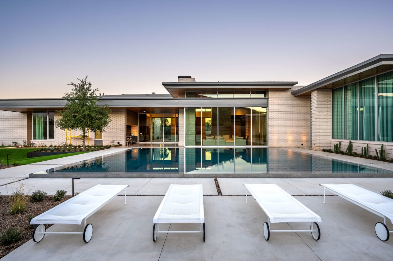 Backyard of luxury modern home with floating pool