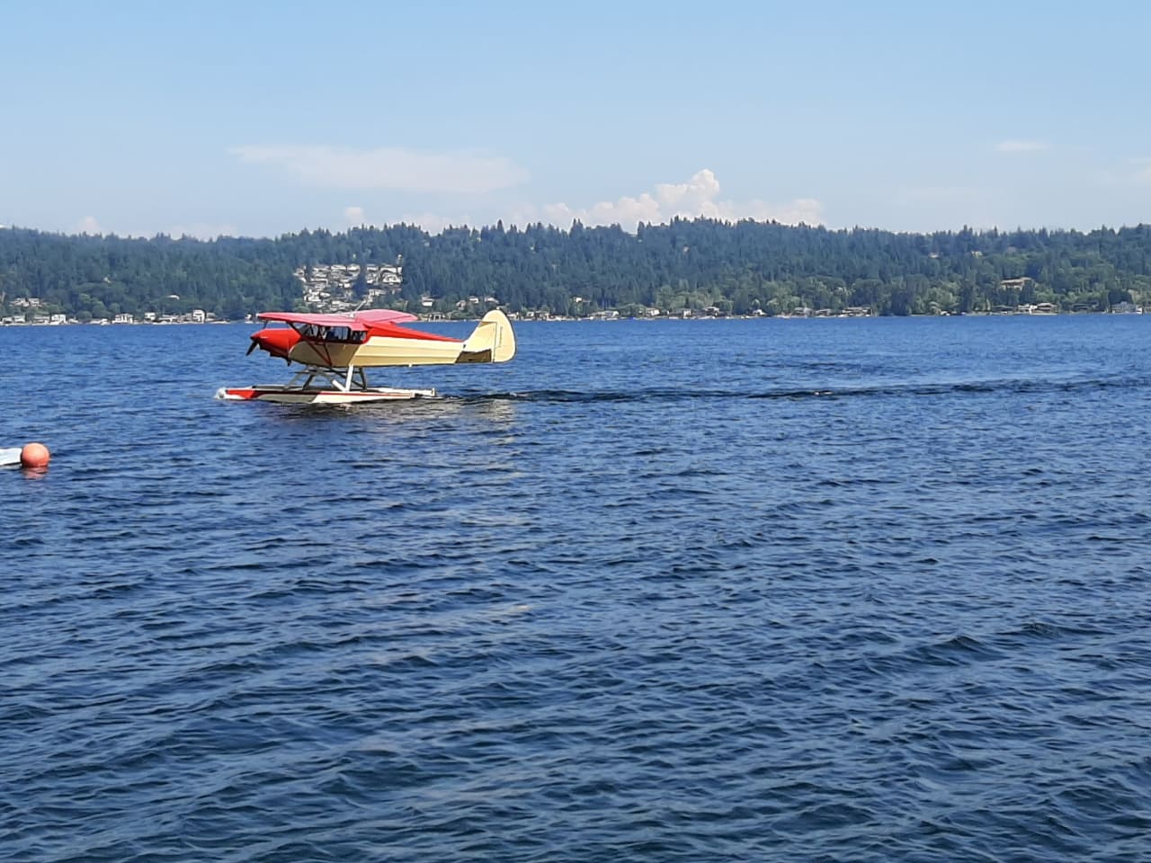 a seaplane floating on top of a large body of water