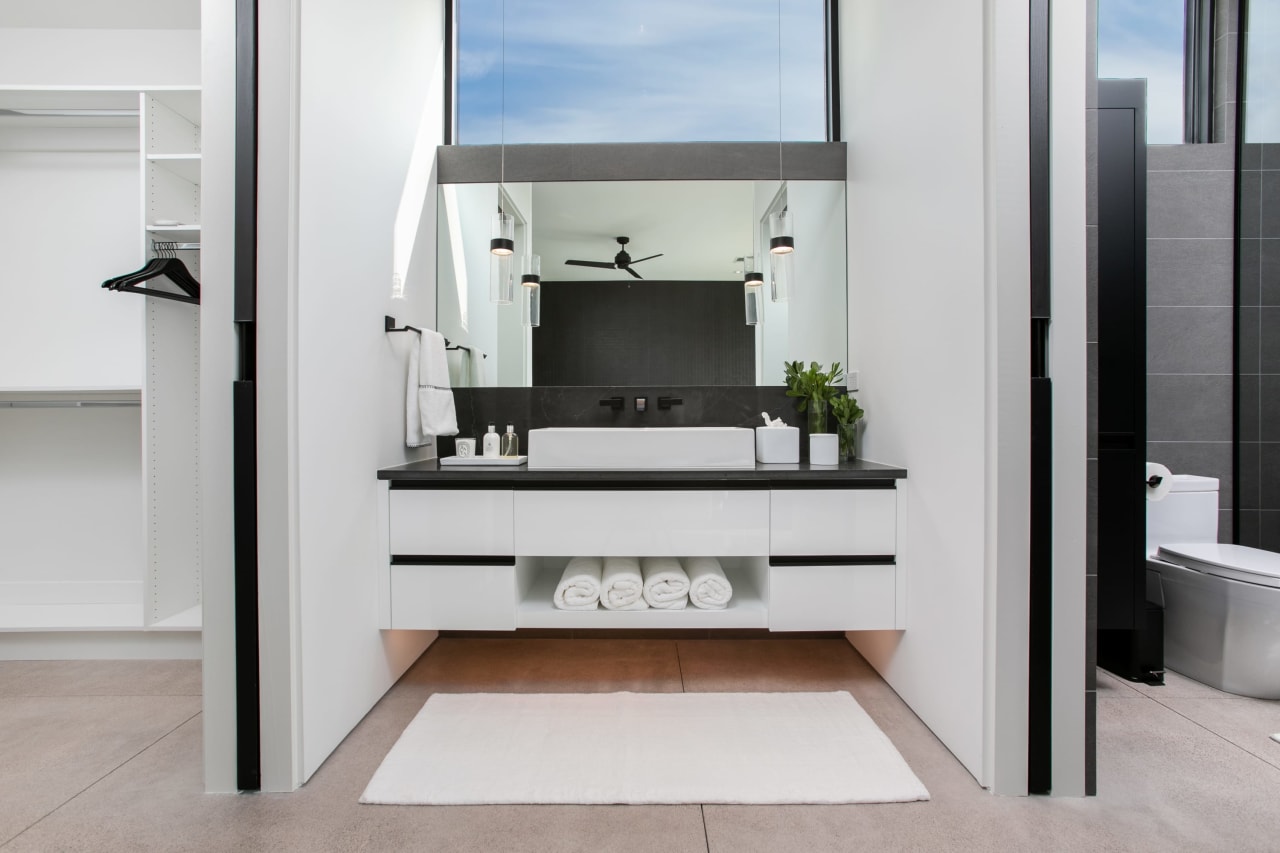 Floating shelf in bathroom of modern luxury home