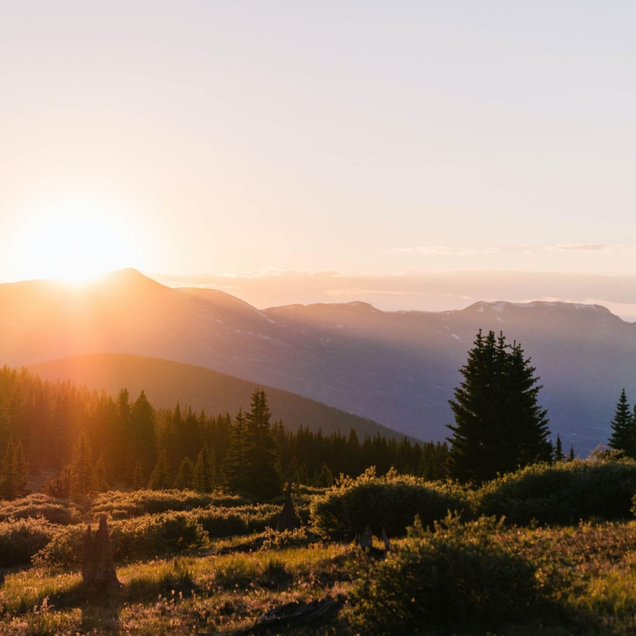 A beautiful sunset over a snow-capped mountain range.