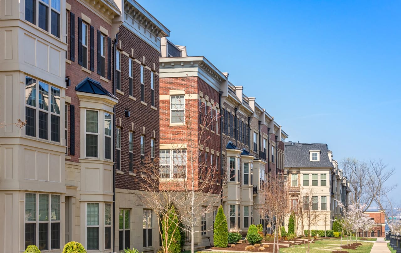 A row of apartment buildings in a residential neighborhood. 