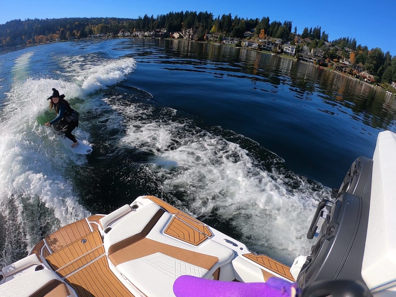 an overlooking view of a lady wearing witch costume riding a waveboard