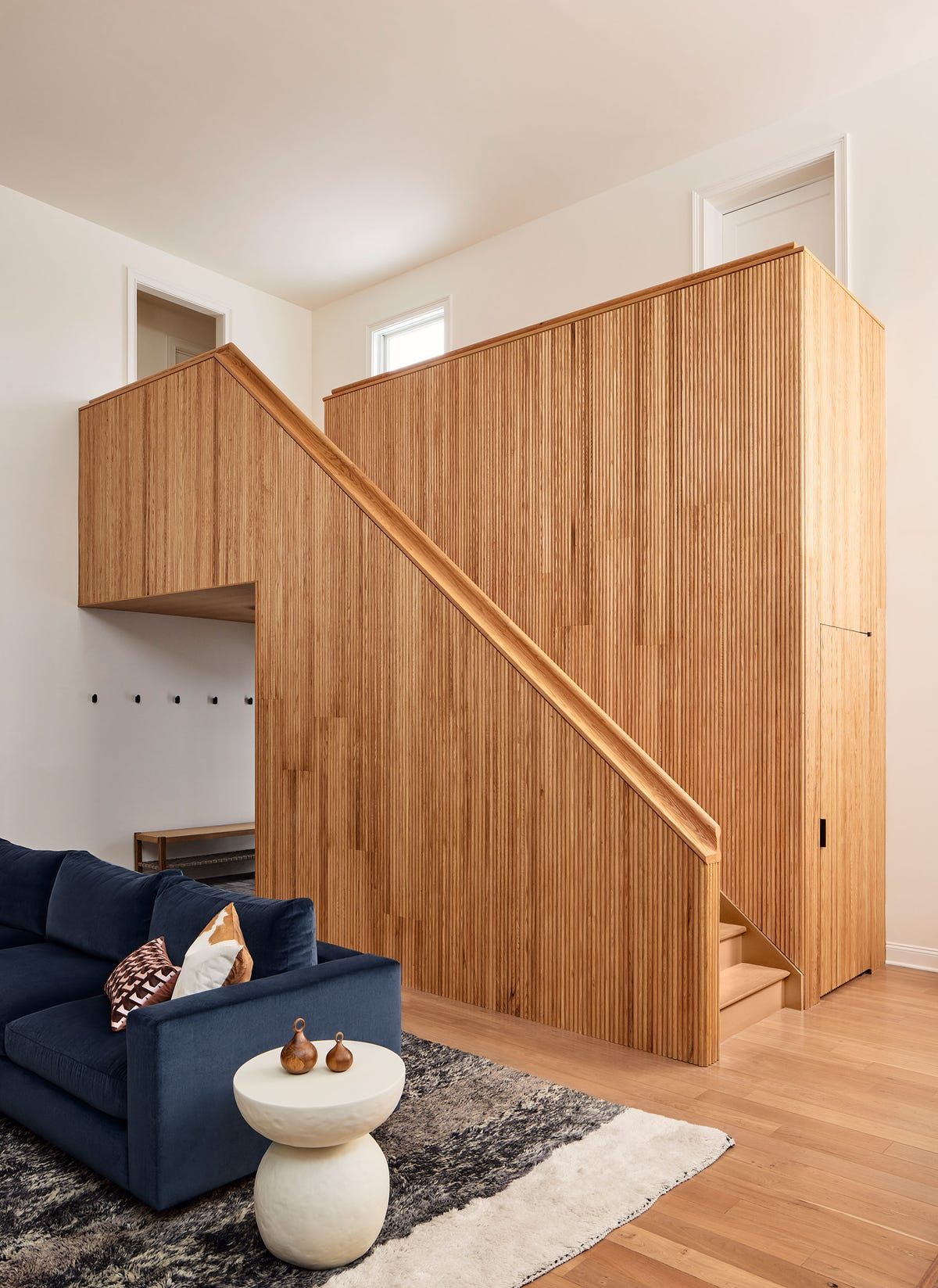 A wood-paneled room in the renovated modern farmhouse.