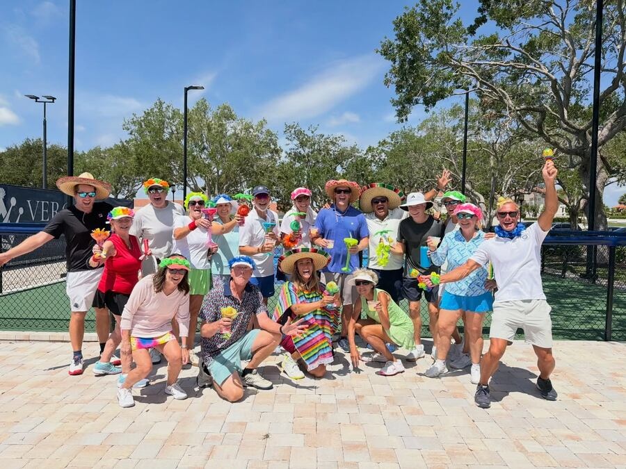 Pickleball players celebrating at a Vero Beach, Florida community social event