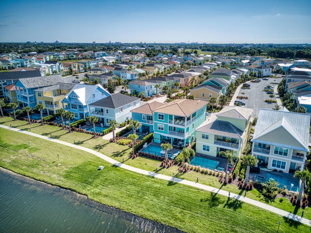 A row of colorful houses in a waterfront community.