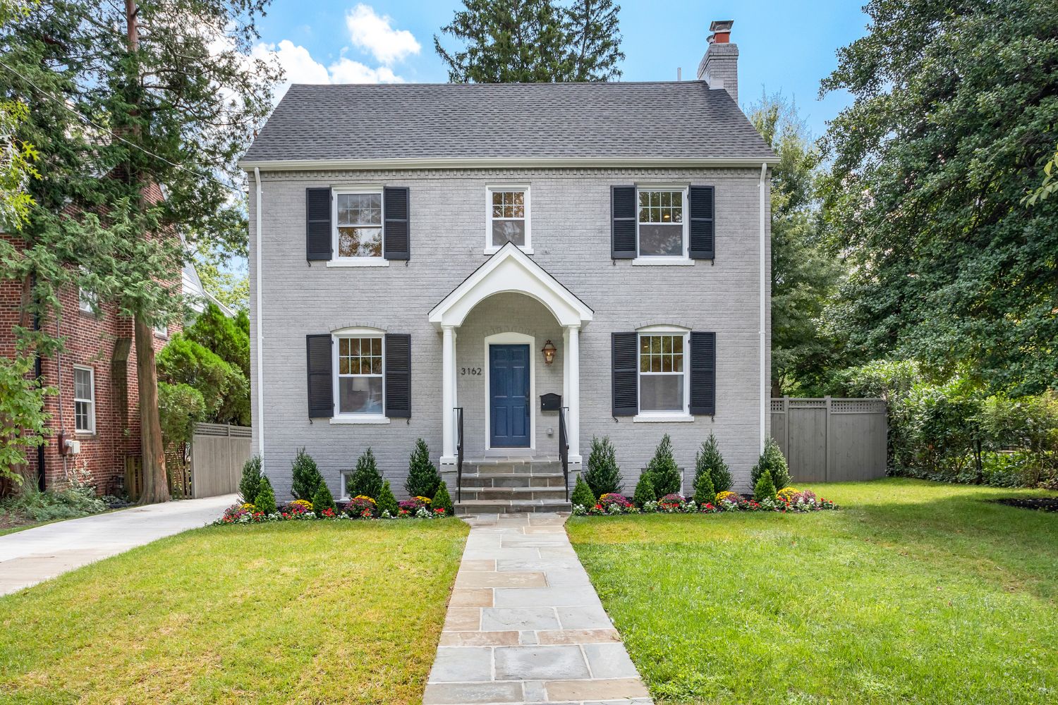 Improve curb appeal with a well-maintained walkway and entrance in Washington DC — low maintenance front yard details that add value