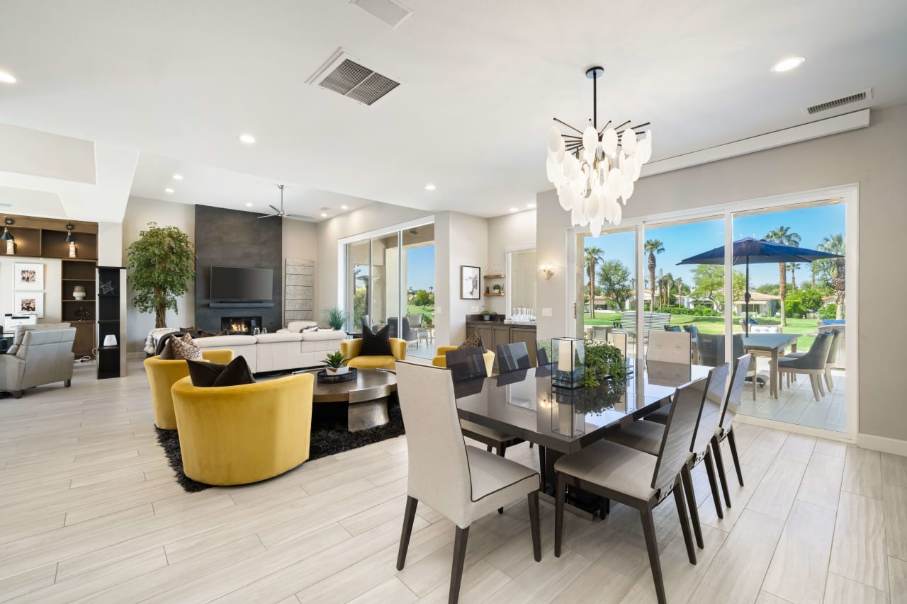 A light-filled dining area featuring a contemporary table and chairs