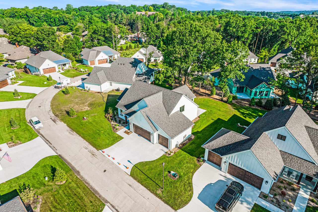 An aerial view of a residential neighborhood with houses and trees