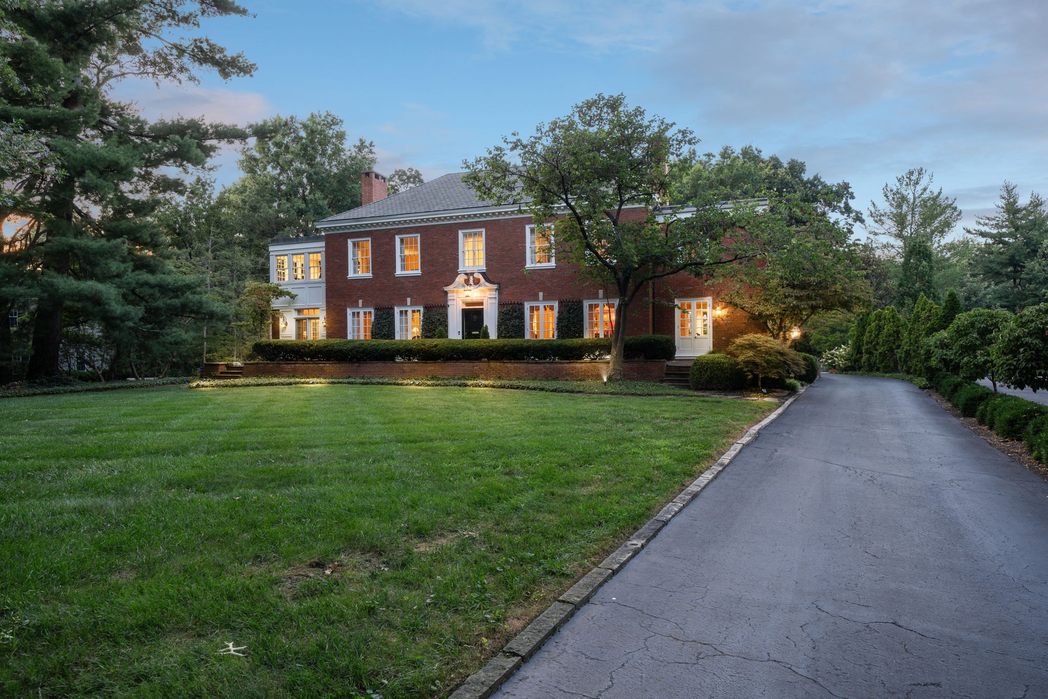 10 Fair Oaks Drive in Ladue at twilight, a home sold by Alyssa Suntrup