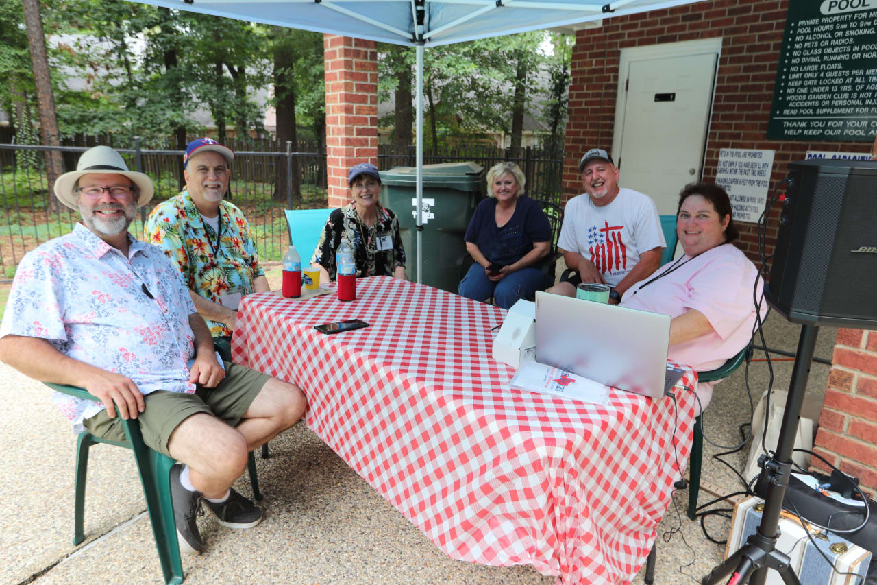 Crutcher & Hartley Team real estate agents in a park