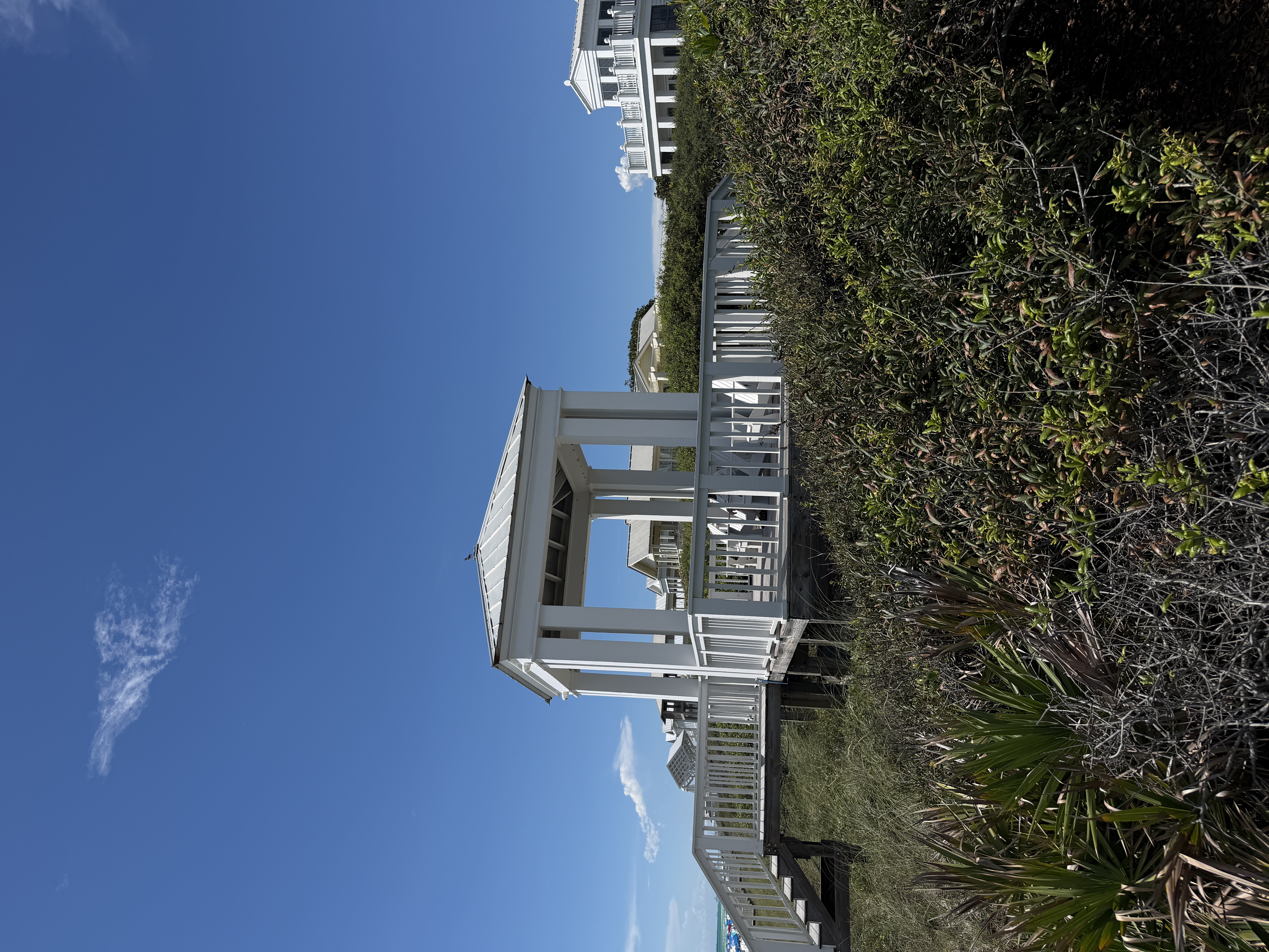 White Seaside Florida beach pavilion beside protected coastal dunes on 30A