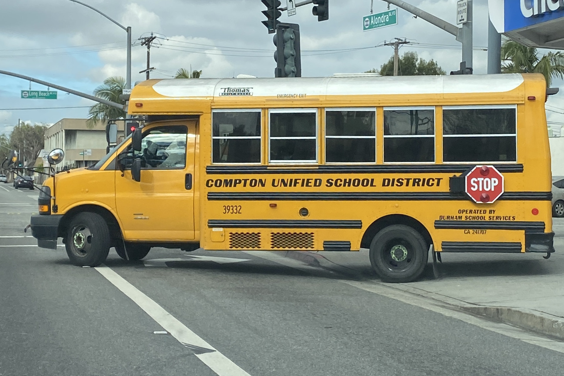 Compton Unified School District school bus at an Alondra Boulevard intersection, photographed in 2024