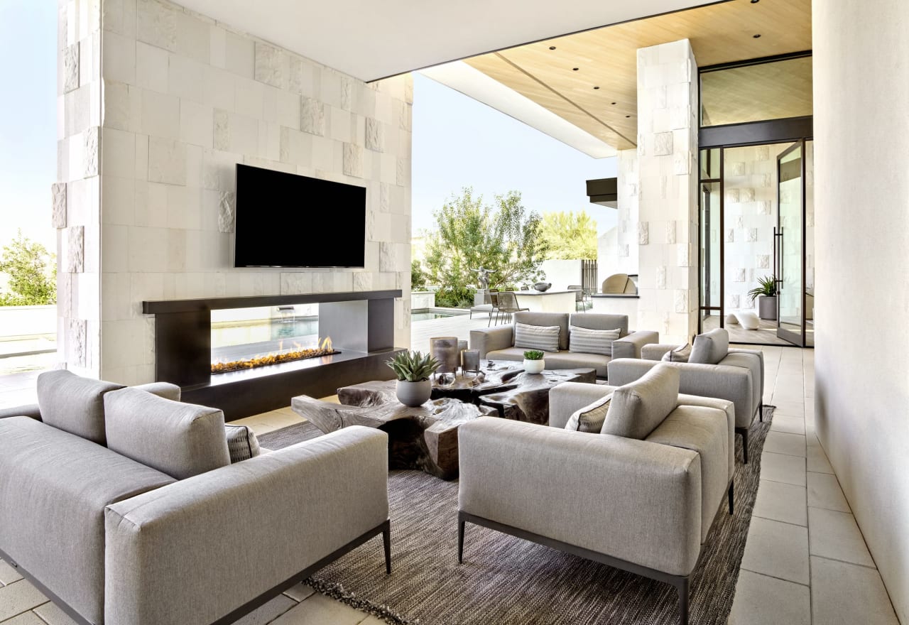 Covered patio with limestone walls and outdoor living