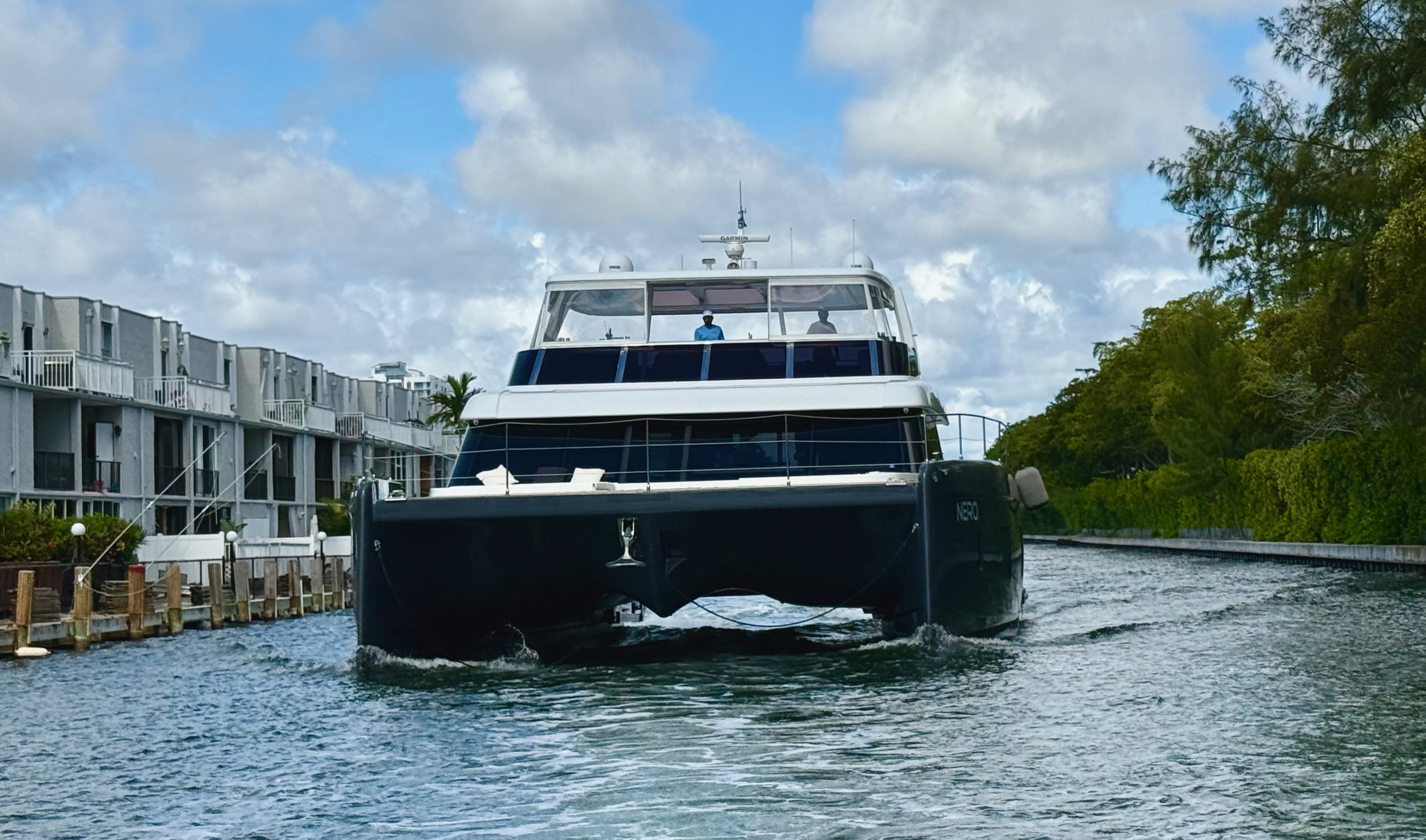 Large motor catamaran yacht navigating the deep water channel between Eastern Shores and Williams Island providing direct ICW access for Williams Island, Marina Palms and Eastern Shores residents