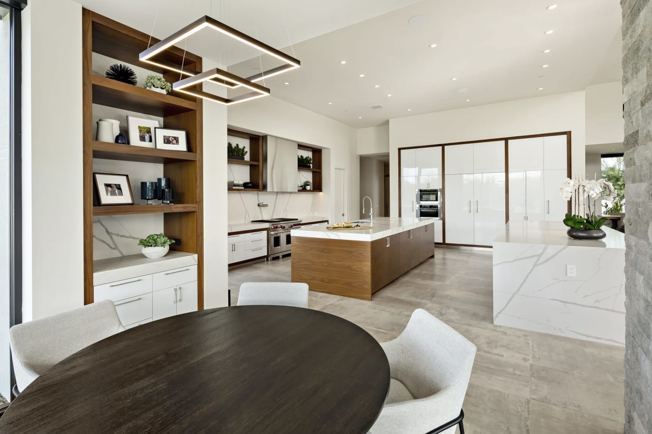 Modern kitchen with white and wood finishes