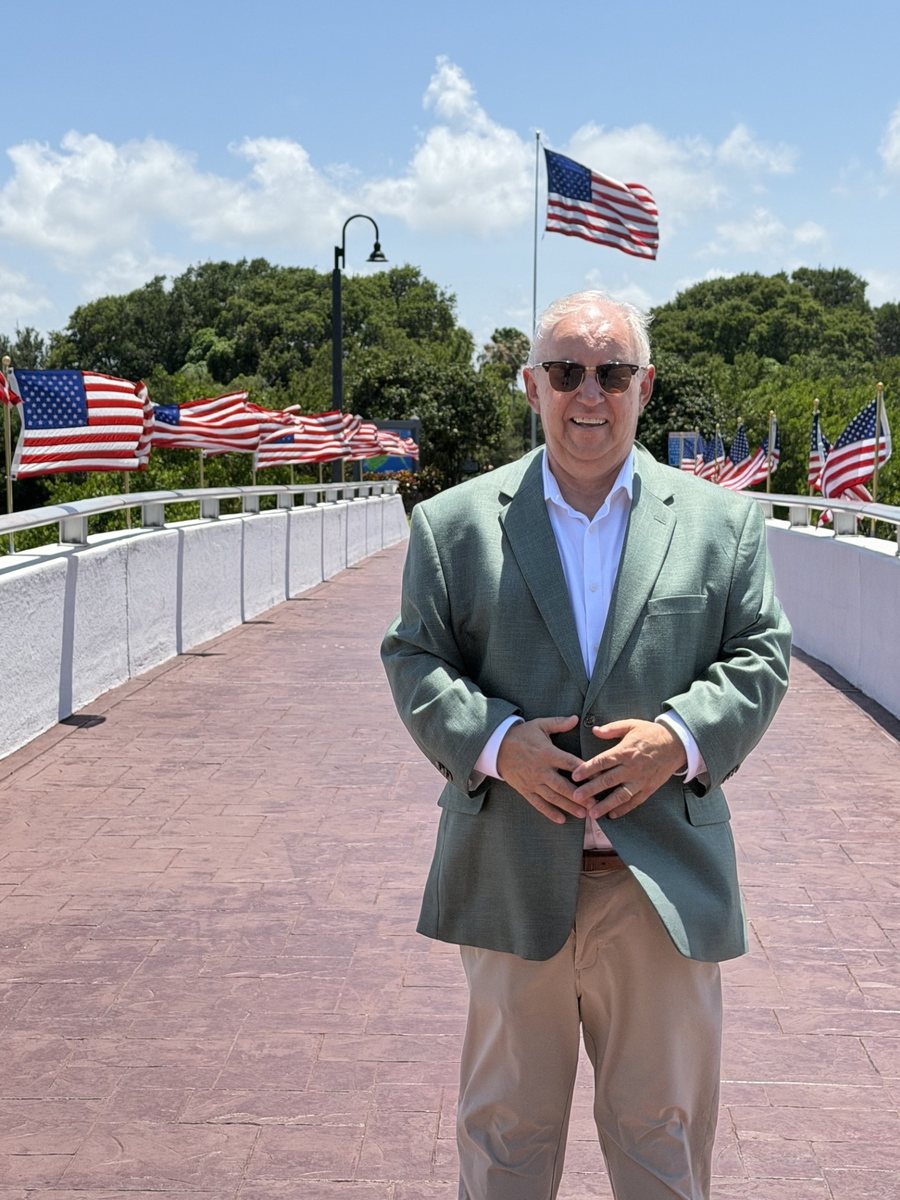 J. Vance Brinkerhoff on the flag-lined bridge to Riverside Park in Vero Beach on Independence Day weekend