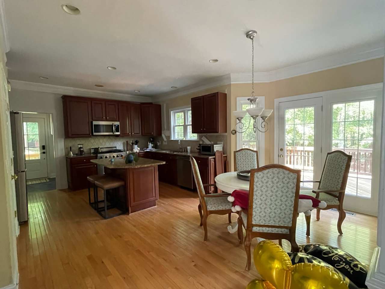 Kitchen With Brown Cabinets and Cupboards