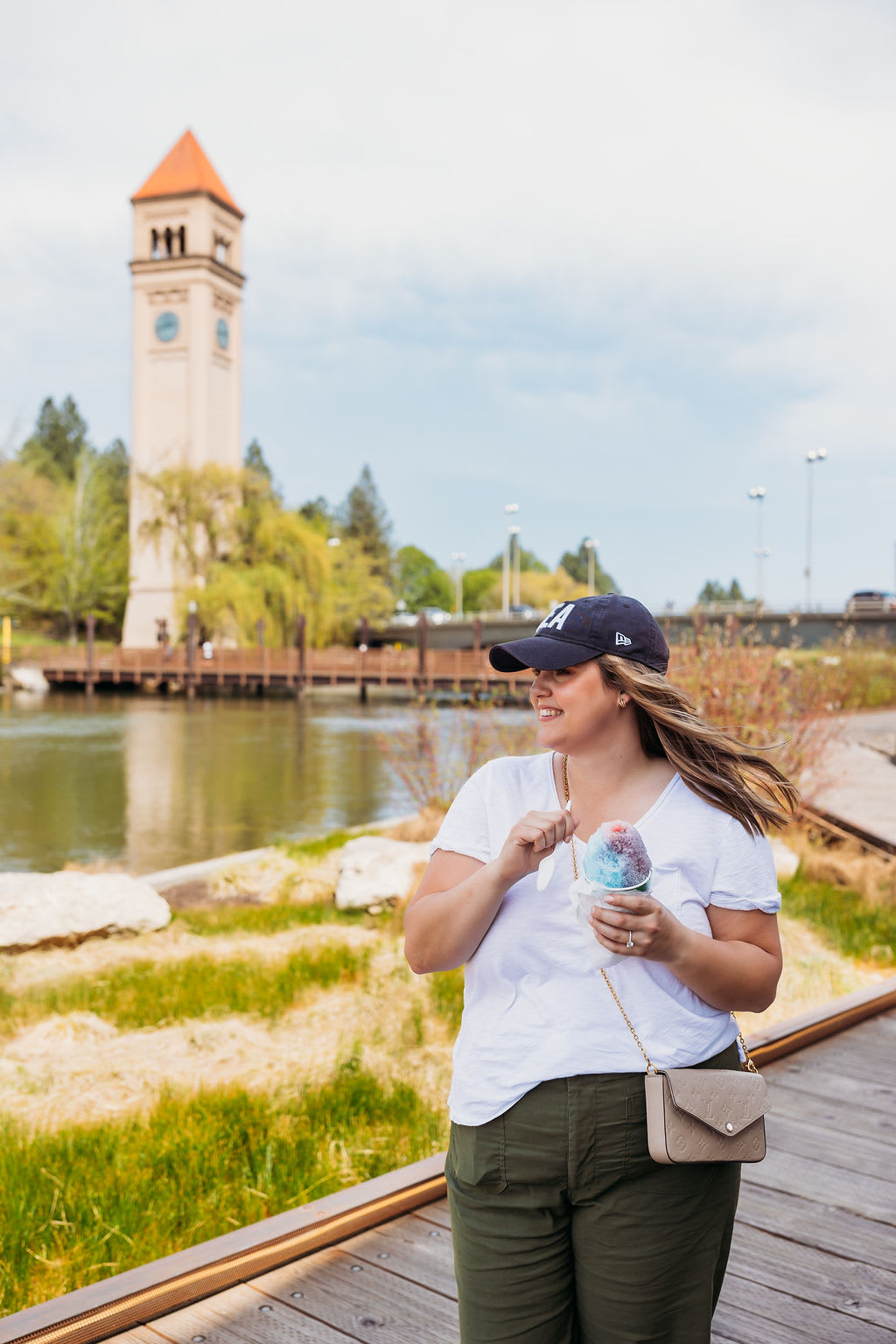 Samara Behler walks in Riverfront Park Spokane eating a slushy.