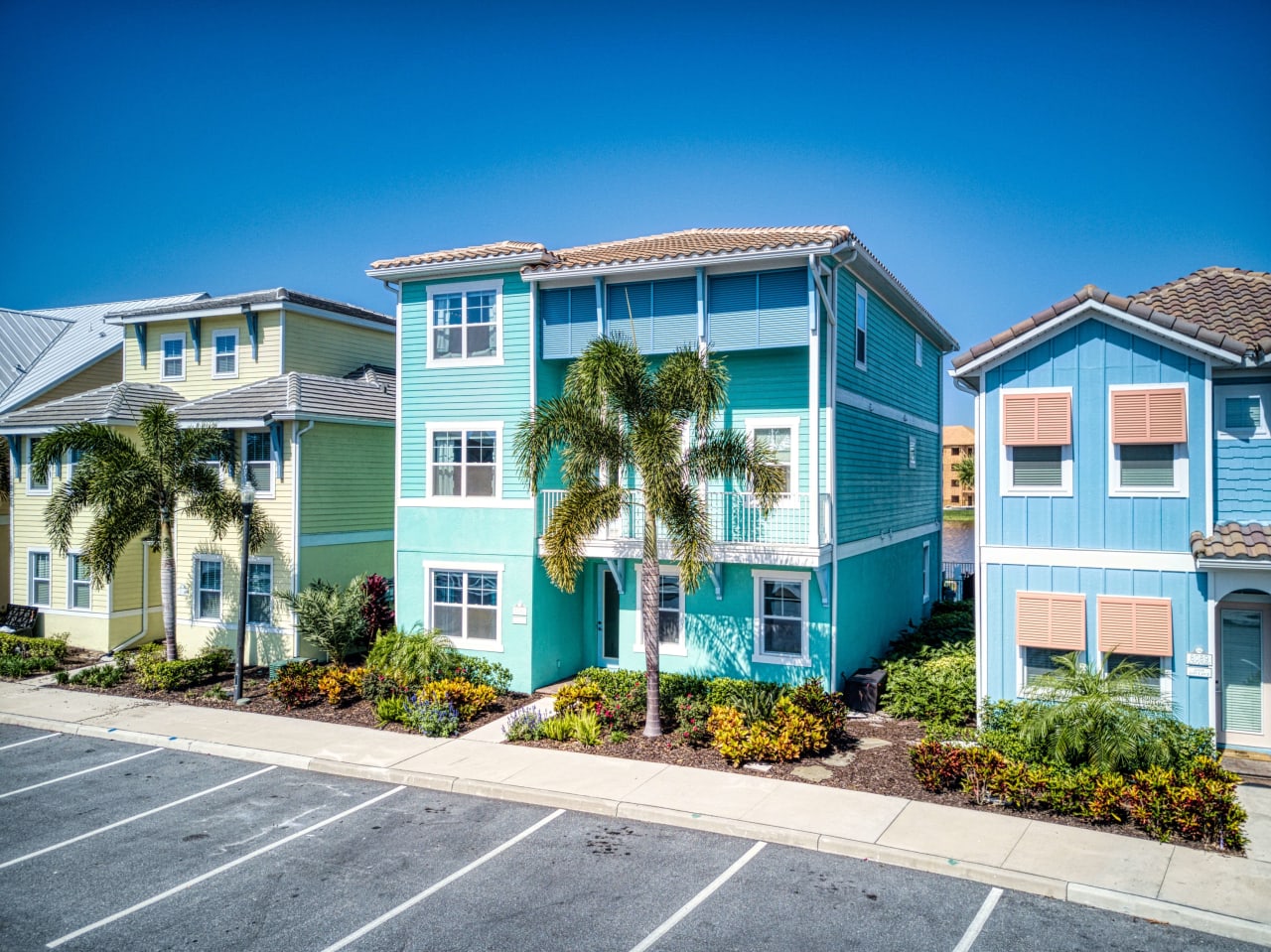 A row of colorful houses in a tropical location.