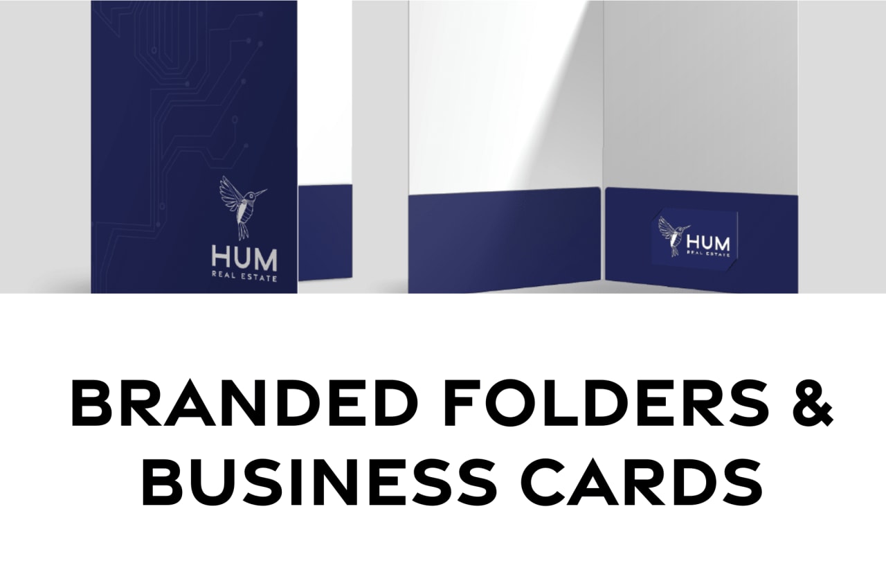 The branded folders and business cards with the "HUM Real Estate" logo. The items are displayed against a white background.