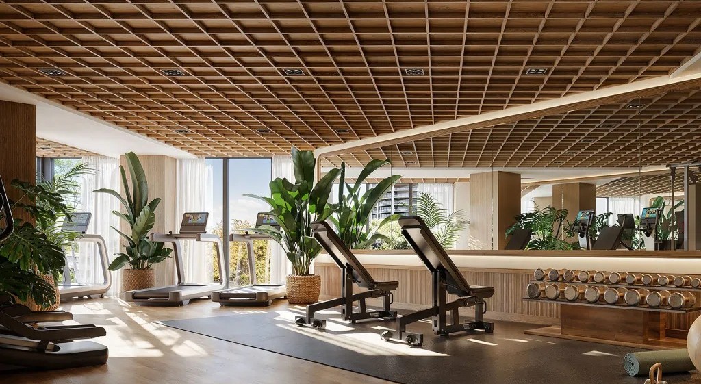 Fitness room with treadmills, weight benches, dumbbells, and a wood-grid ceiling.