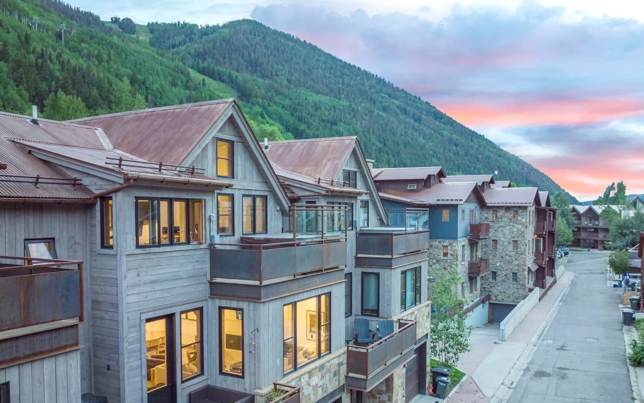 Modern mountain home with wooden exterior and large windows in Telluride, Colorado.