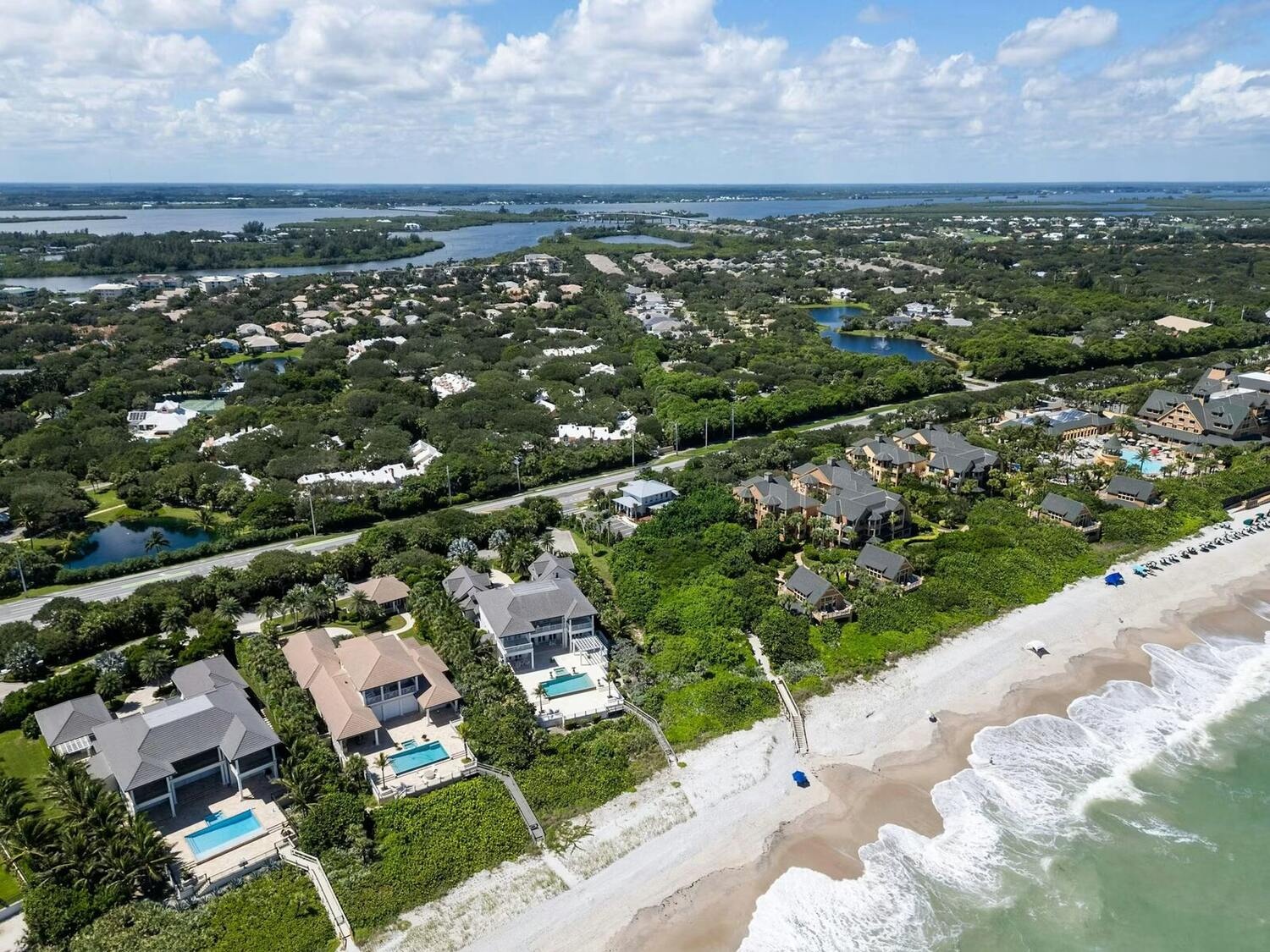 Aerial drone view of Vero Beach barrier island luxury oceanfront estates between the Atlantic Ocean and the Indian River Lagoon, Florida 32963